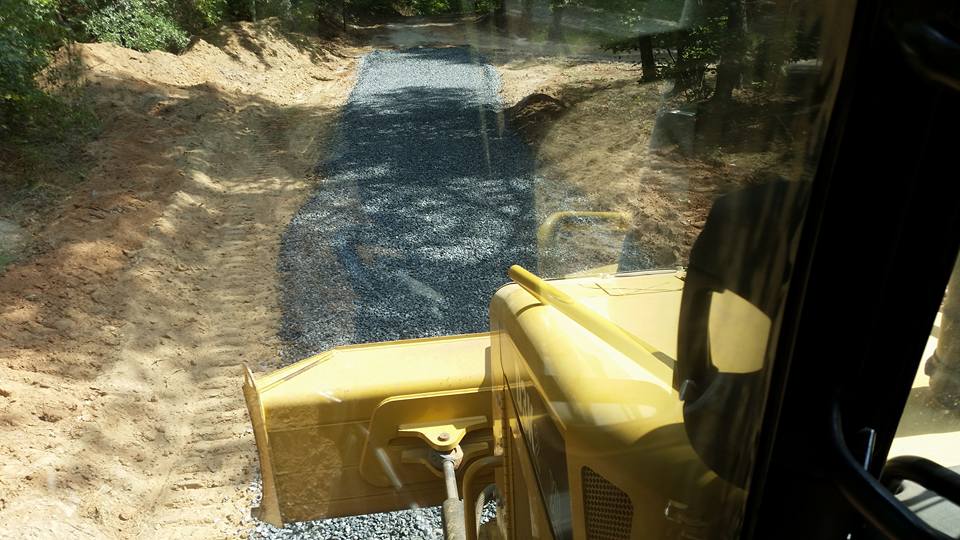 Bulldozer spreading crushed stone